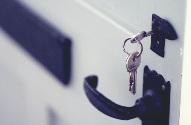 Keys in a white front door